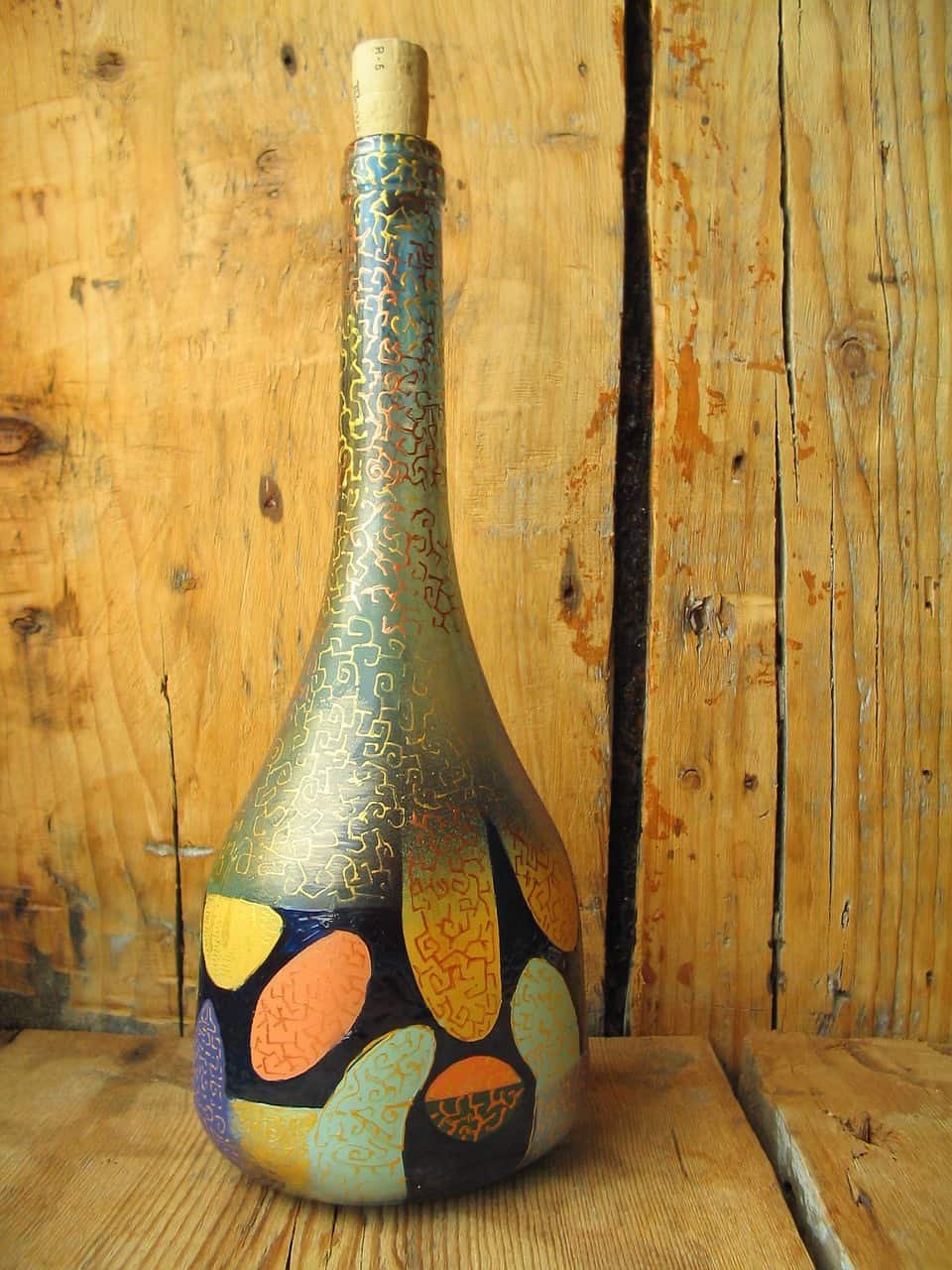 Botella de vidrio pintada con acrílico
